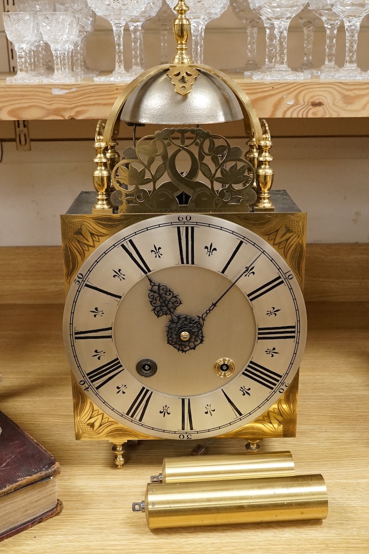 A large lantern style wall clock, 60cm high